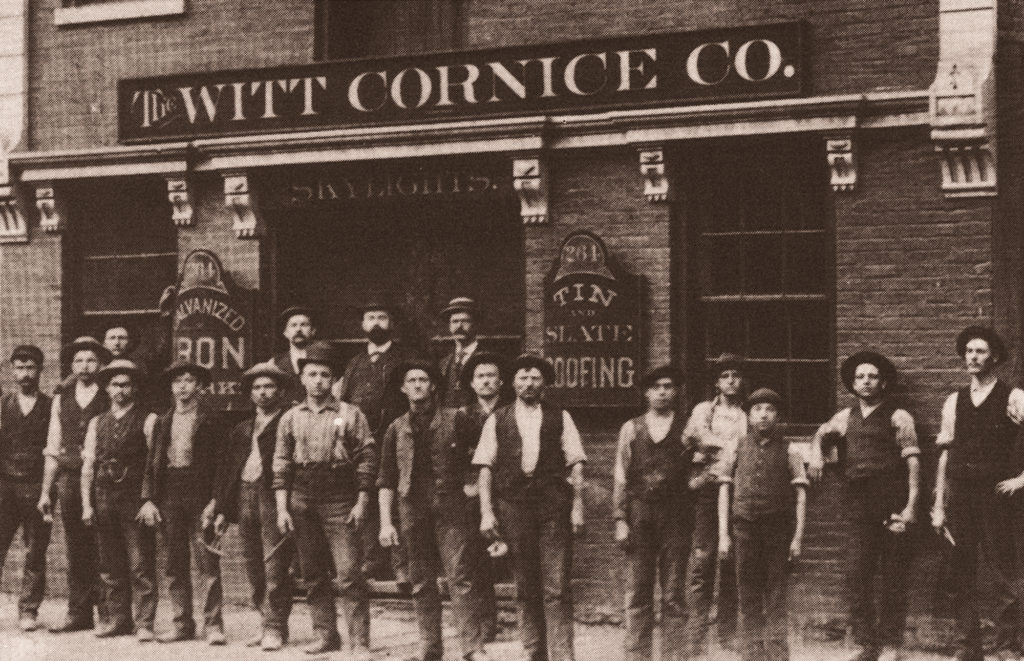 Witt Industries Metal Outdoor Bench & Outdoor Garbage Cans Historic Photo of Employees Standing In Front of Building