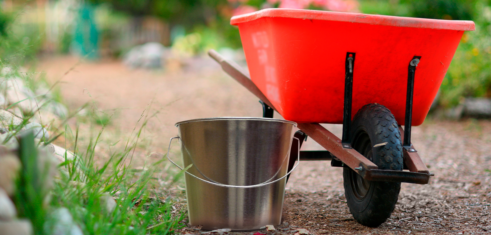 Witt Site Furnishings Industrial Pail and Wheel Barrel in Outdoor Environment Witt Industrial Pail and Wheel Barrel Site Furnishings Outdoor Environmental